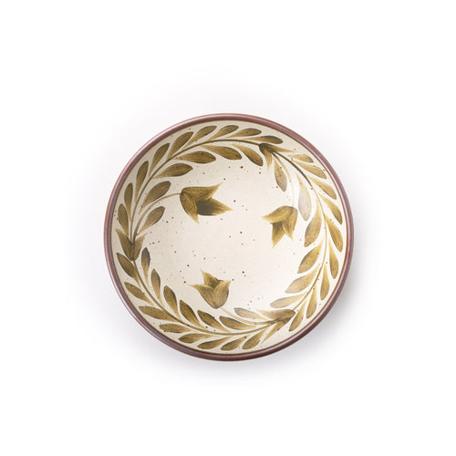 Overhead of a Medium ceramic shallow bowl with a hand-painted olive green leaf border on a cream interior and exterior with an exposed clay rim.